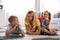 Happy mother with her children on floor at home