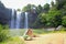 Happy mother with her daughter outdoors. Whangarei Falls, New Zealand