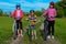 Happy mother and kids on bikes cycling outdoors