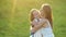 Happy mother meets excited daughter after day at school