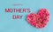 Happy Mother`s day banner.Holiday card with a heart of pink roses on a blue background.Congratulation.Creative.day.Women