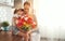 Happy mother`s day! child daughter gives mother a bouquet of f