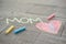 Happy Mother`s Day. Child draws for her mother a picture surprise of crayons on the asphalt. LOVE MOM