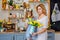 Happy Mother`s Day. The child`s daughter congratulates her mother and holds a bouquet of yellow tulips