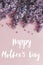 Happy Mother`s day text and lilac flowers border on pink paper, stylish floral flat lay. Happy mothers day greeting card