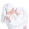 Happy mother and young daughter in white dressing gown