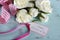Happy Mothers Day gift of white roses bouquet with pink stripe ribbon and gift tag