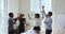 Happy motivated funny multiracial business team people dancing in office