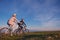 Happy mountainbike couple outdoors have fun together on a summer afternoon sunset