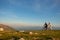 Happy mountainbike couple outdoors have fun together on a summer afternoon sunset