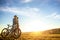 Happy mountainbike couple outdoors have fun together on a summer afternoon sunset