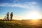 Happy mountainbike couple outdoors have fun together on a summer afternoon sunset