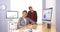 Happy multi-ethnic businesswomen sitting in office