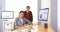 Happy multi-ethnic businesswomen sitting in office