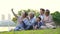 Happy multi generation asian family taking a selfie outdoors