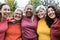 Happy multi generational women having fun together after sport workout outdoor - Focus on african senior woman face