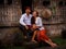 Happy multicultural couple. Romantic concept. Couple in love. Bamboo house. Caucasian wife and Balinese husband wearing