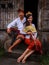 Happy multicultural couple. Romantic concept. Couple in love. Bamboo house. Caucasian wife and Balinese husband wearing