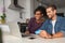 Happy multiethnic ouple making online payment