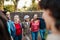 Happy multigenerational group of people with different ethnicities having fun in a public park