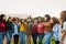 Happy multigenerational group of women with different ages and ethnicities having fun in a public park