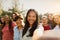 Happy multigenerational group of women with different ethnicities having fun taking selfie with smartphone camera in a public park