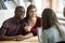 Happy multiracial couple excited about house purchasing