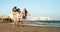 Happy multiracial females with different body size having fun walking on the beach during summer holiday