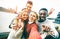 Happy multiracial friends group taking selfie in London city