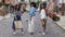 Happy multiracial girls with shopping bags outdoors