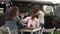 Happy multiracial people enjoying meal in a street food truck