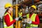 Happy multiracial people working inside logistic warehouse