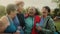 Happy multiracial senior women having fun after workout exercises in park