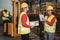 Happy multiracial workers talking inside warehouse store - Focus on woman face