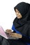 Happy muslim asian lady using laptop