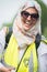 Happy muslim woman at the counter-demo by pressure group Unite Against Fascism in Whitehall, London, UK.