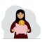 Happy muslim woman holds a piggy bank, a coin falls into the piggy bank. The concept of saving finance, savings
