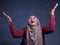 Happy Muslim Woman Shows Winning Gesture Greeting Something