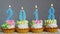 Happy new 2018 year, blue number candles on cupcakes