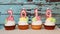 Happy new 2019 year , number candles on cupcakes with blue wooden background