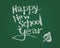 Happy new school year. Vector chalk text on green blackboard.