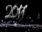 Happy new year 2017 numbers lettering written with fire flame or smoke on black background