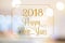 Happy New year 2018 gold sparkling glitter word with golden frame at abstract blurred bokeh light background, Holiday concept