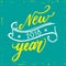 Happy new year 2018 hand written lettering quote with falling snow on blue mint background. Modern brush calligraphy -