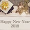 Happy New Year 2018 inscription with golden decorations