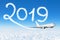 Happy New year 2019 concept travel. Drawing by passenger airplane vapor contrail in sky