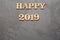 Happy New Year 2019 - Letters on wood and black background