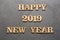 Happy New Year 2019 - Letters on wood and black background