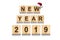 Happy New Year 2019 Words made up of alphabet on wooden cubes. Wooden background. Christmas, New Year background