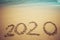 Happy New Year 2020 concept, 2020 number lettering on the sea beach.